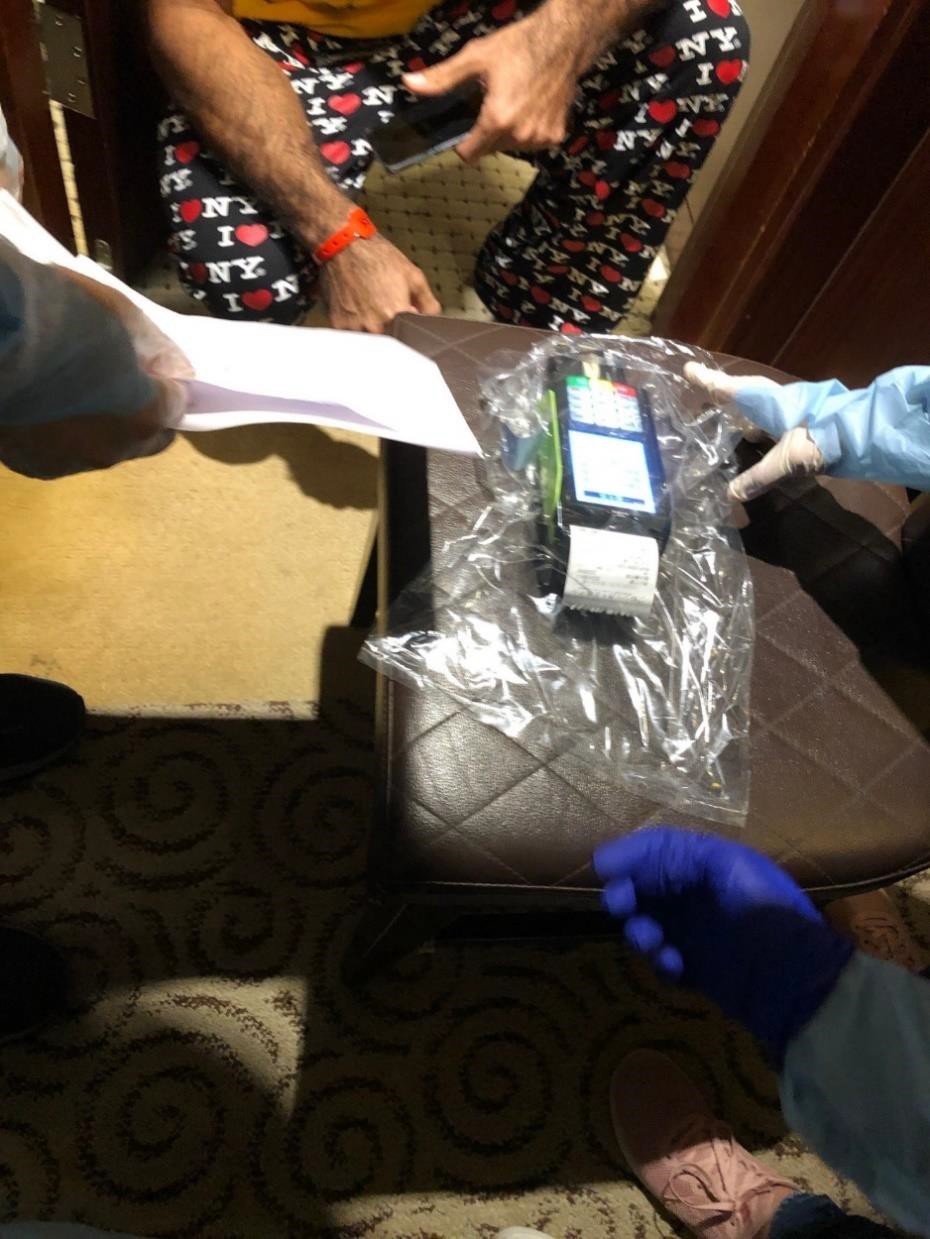 Kuwaiti male pays the fine by credit card.